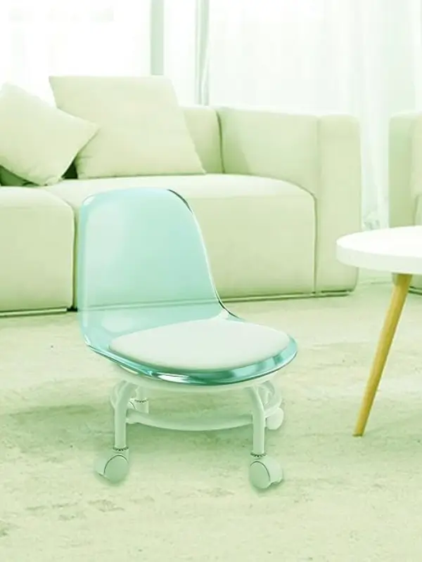 Transparent acrylic chair with green cushion and 360° rotating base