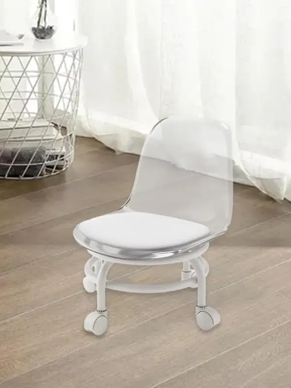 Transparent acrylic chair with white cushioned seat and 360° swivel base
