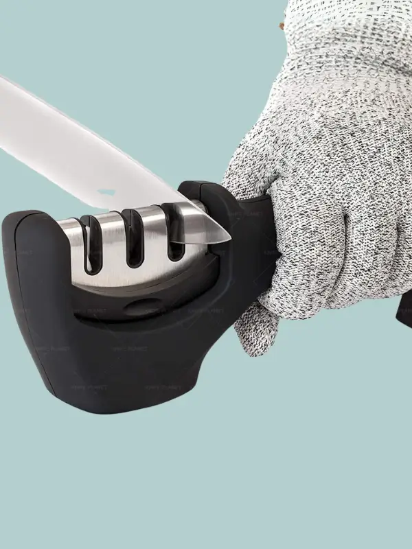 Manual knife sharpener with three slots for coarse, medium, and fine sharpening, ideal for kitchen use